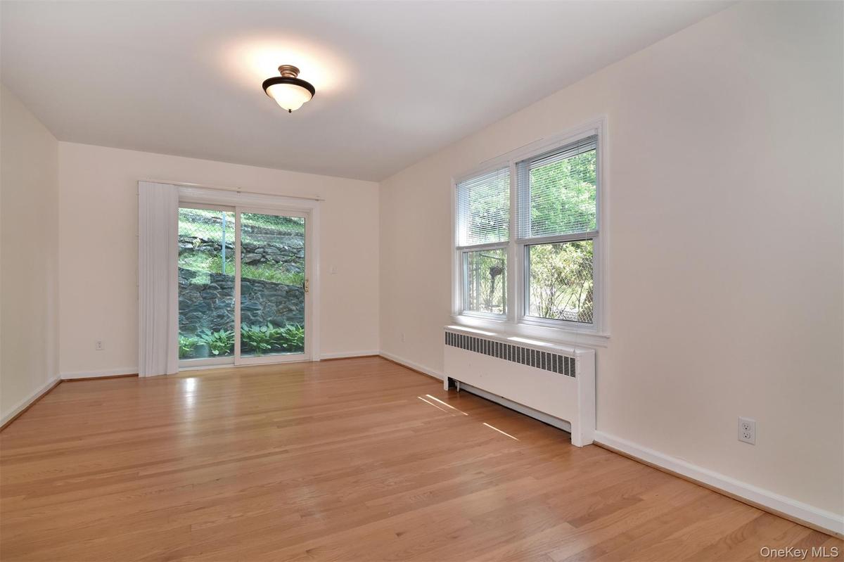 Full-size formal dining room with sliders out backyard.