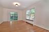 Full-size formal dining room with sliders out backyard.