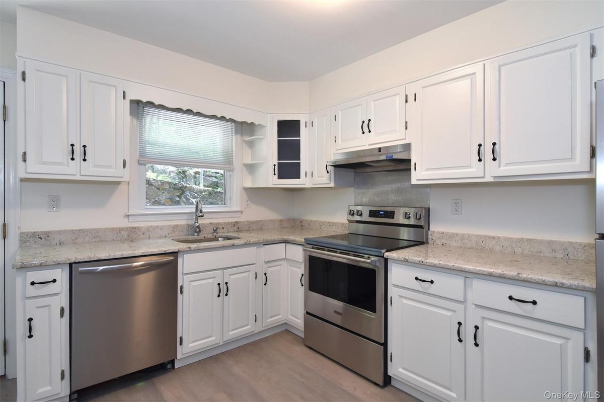 New kitchen with stainless steel appliances.