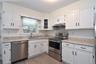 New kitchen with stainless steel appliances.