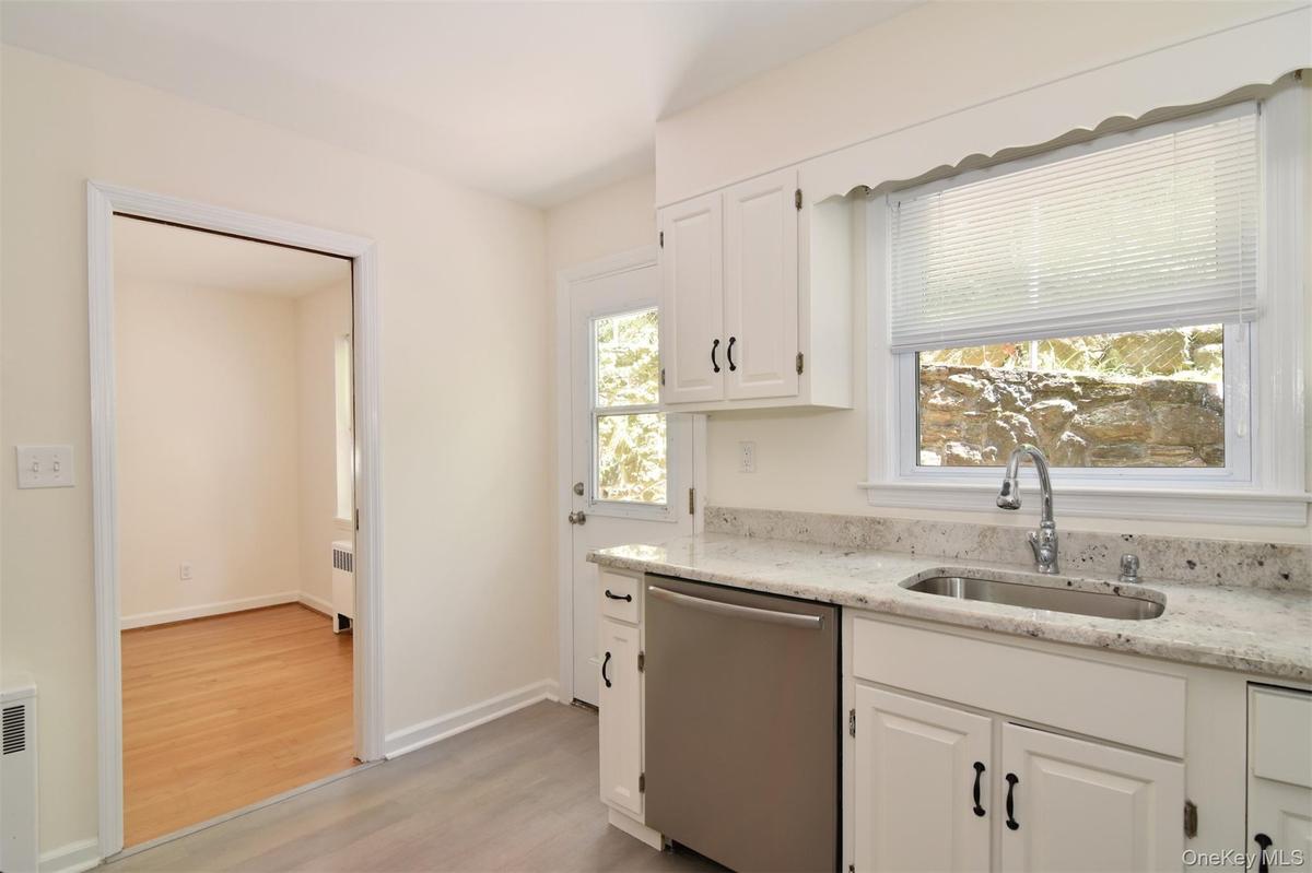 Kitchen with door out to patio for convenient summer grilling.