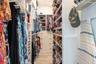 Primary Suite Closet.   Custom closet organizer runs floor to ceiling to maximize storage options.