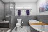Relaxing soaker tub in Primary Bathroom with hot water provided by the On Demand Water Heater that supports 8.5 GPM so you can be soaking in minutes!