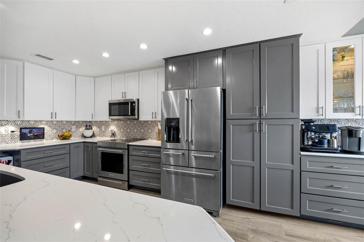 Kitchen cabinets go to the ceiling for maximum storage potential!