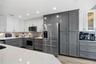 Kitchen cabinets go to the ceiling for maximum storage potential!