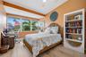 Main Floor Bedroom. Large windows allow in plenty of natural light.