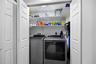 Laundry Closet with full size washer and dryer on main living level.