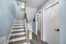 Interior entrance to unit showing door to garage and door to ground level entertainment room.