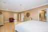 Bedroom featuring light wood-finish flooring, recessed lighting, and crown molding