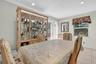 Dining room featuring light tile patterned flooring and recessed lighting