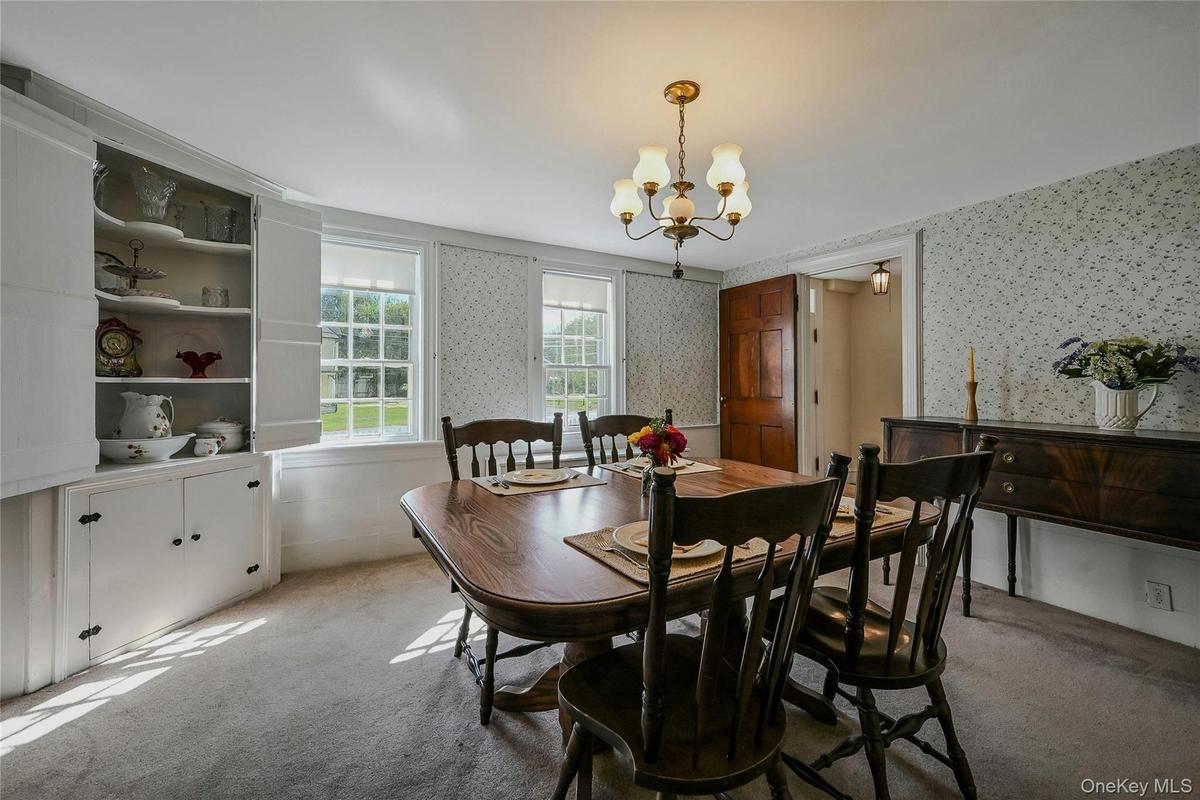 formal dining Room has built in corner cabinet