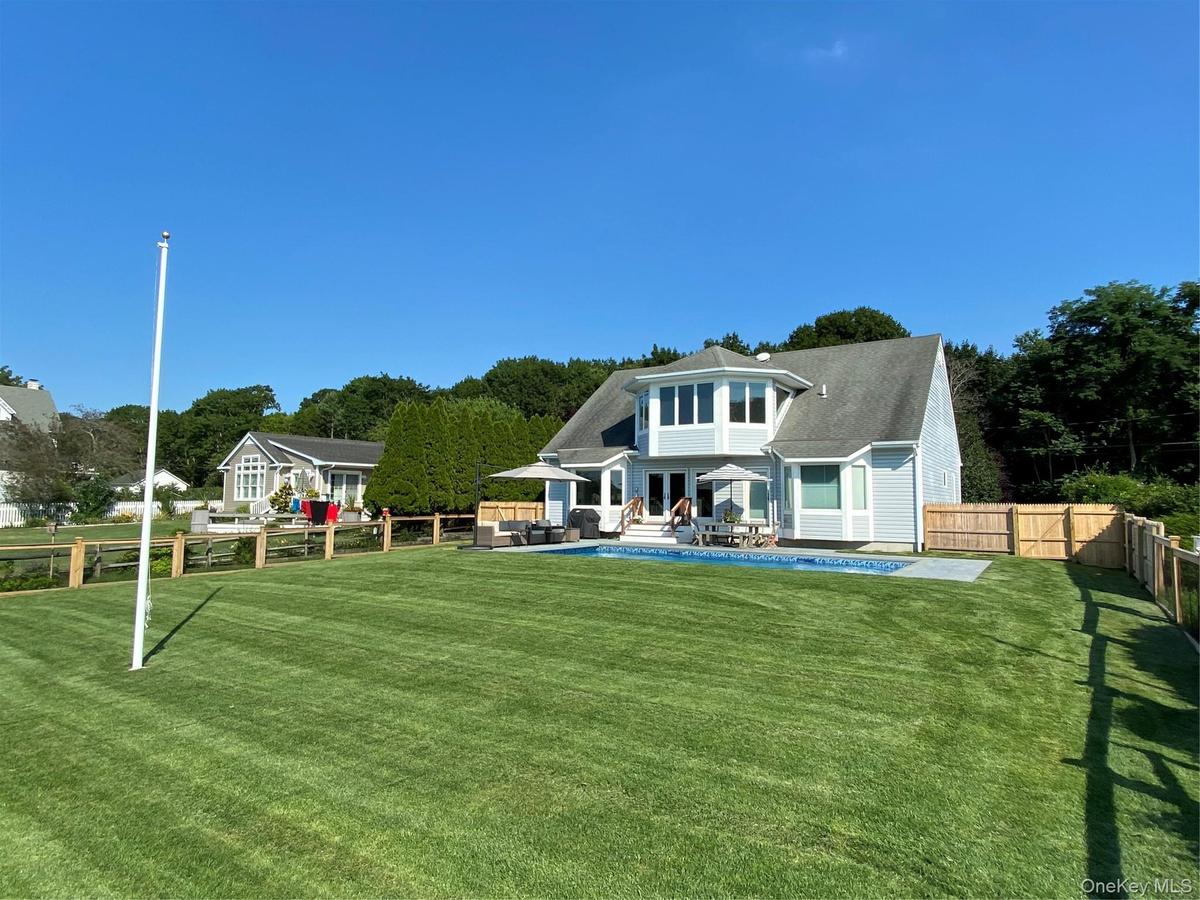 Nicely manicured yard for a game of croquet!