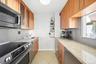 Galley Kitchen equip with high end Bosche en-suite and Perlick under-counter refrigerator and freezer.