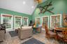 Sunroom / solarium featuring high vaulted ceiling and recessed lighting