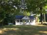 View of front facade featuring a front yard