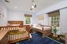 Bedroom with wood finished floors and recessed lighting