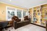 Sitting room with healthy amount of natural light, crown molding, and recessed lighting