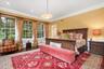 Bedroom featuring ornamental molding and wood finished floors