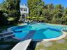 View of pool featuring a diving board