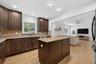Open concept kitchen & living room - virtually staged