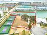 Situated near pickleball courts in the Skimmer Bay Subdivision of the Pasadena Yacht & Country Club