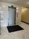 Common area with tile walls