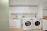 Laundry and Utility Room with Sink, full-sized machines and plentiful storage
