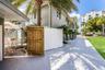 Gated courtyard leads to laundry, dining areas, fountain, gazebo and hot tub.