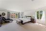 Oversized primary bedroom suite with large closets and a private ensuite bathroom