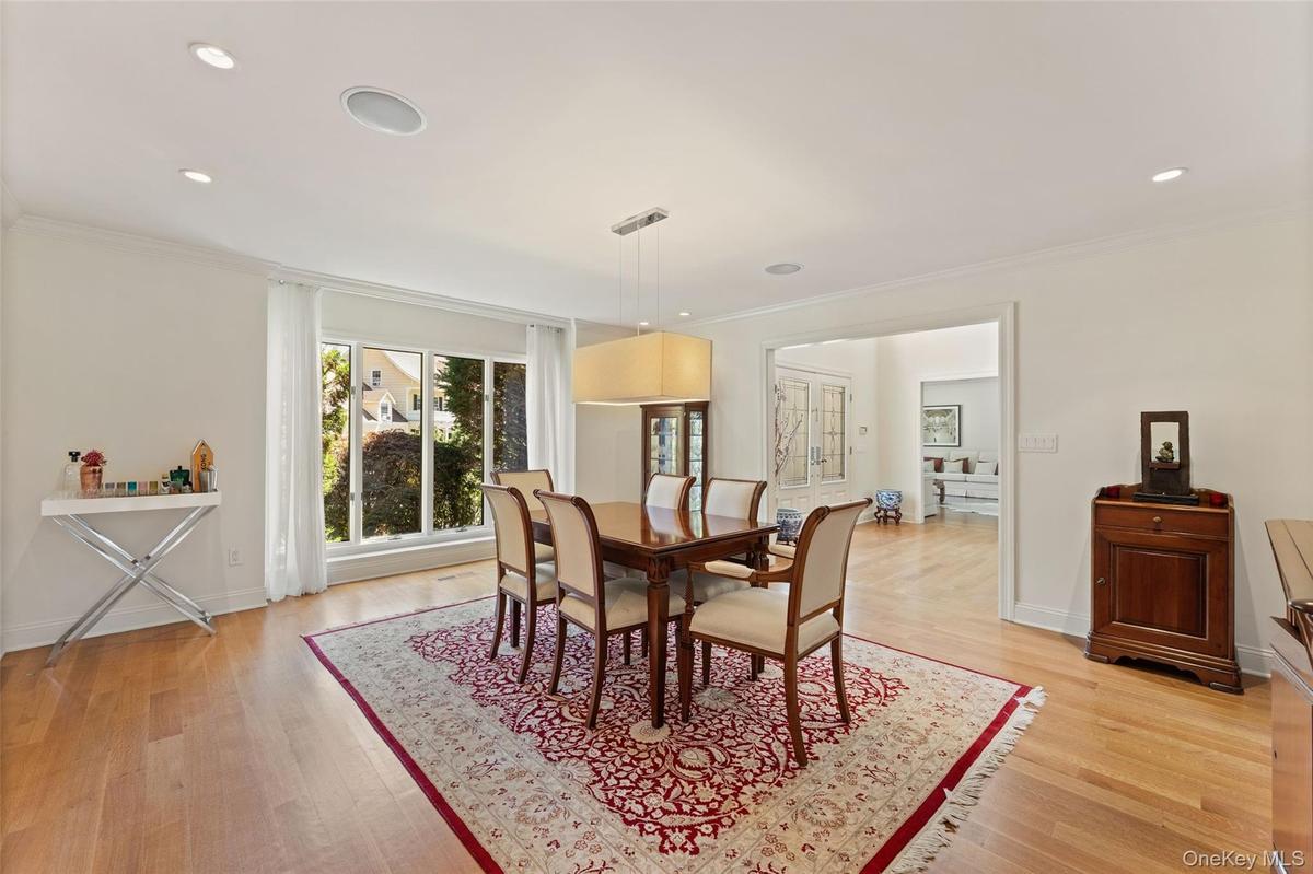Oversized formal dining room with access to the kitchen for easy holiday hosting