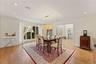 Oversized formal dining room with access to the kitchen for easy holiday hosting
