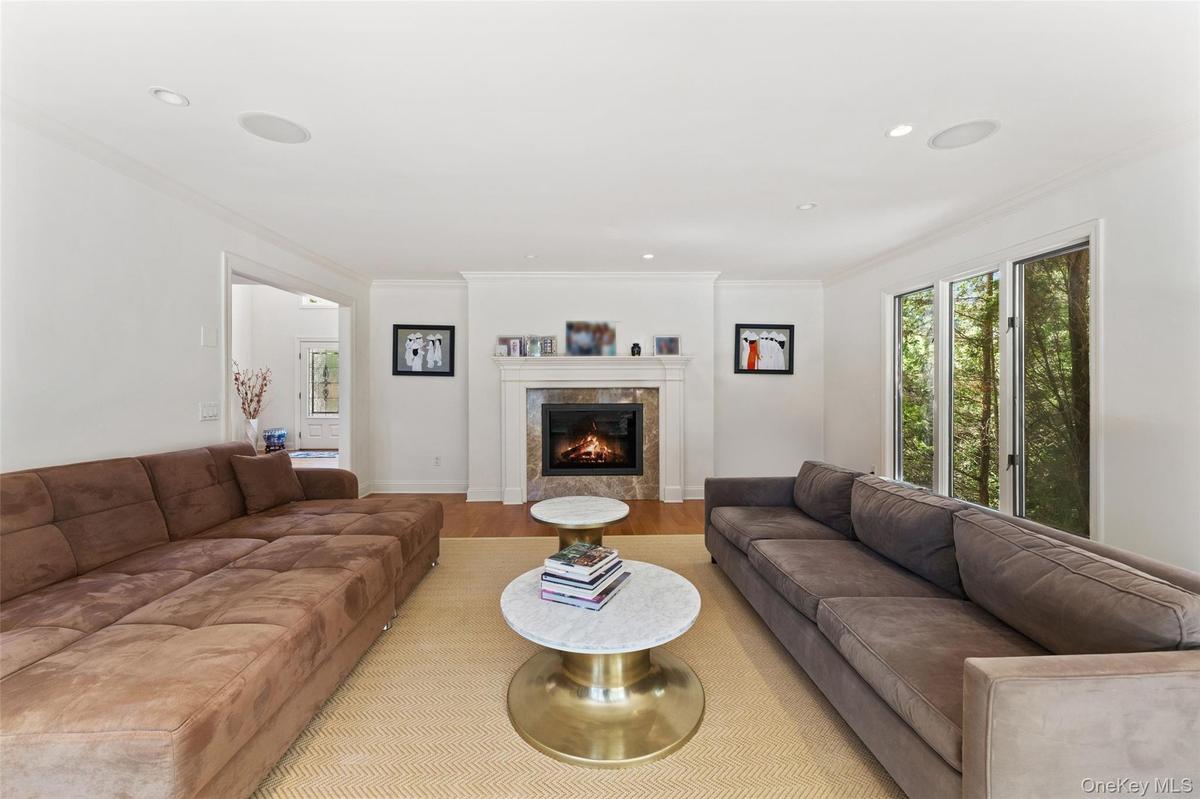 Another fireplace provides the perfect spot for cozy winter gatherings