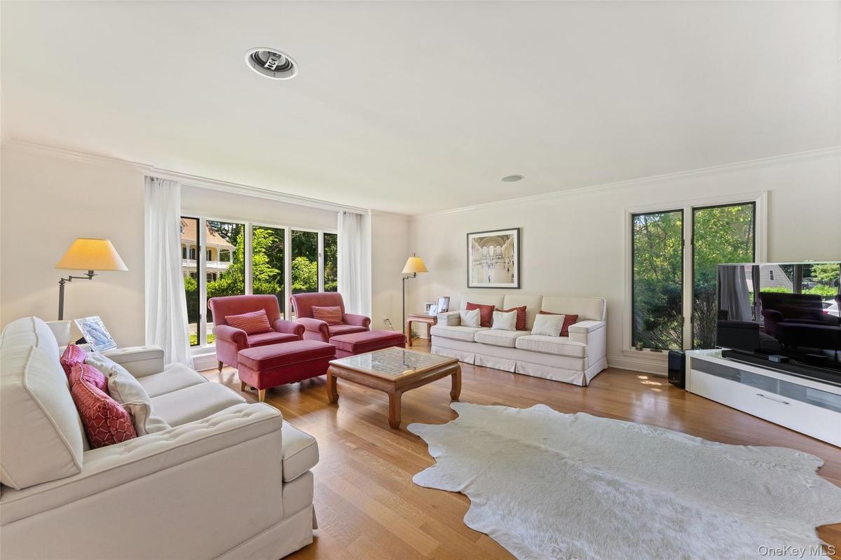 Sun filled living room with large windows