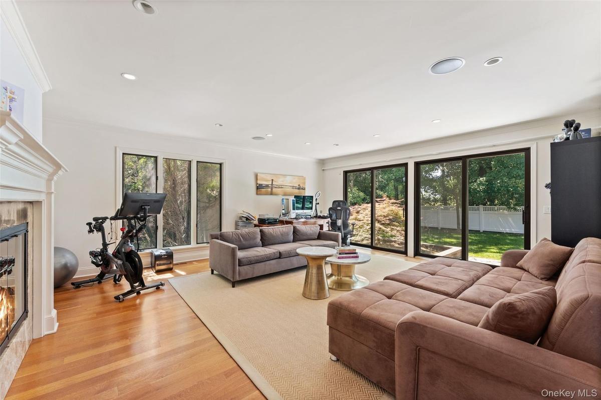 Den with large sliding doors providing access to the backyard