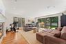 Den with large sliding doors providing access to the backyard