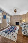 Den with Wood Burning Fireplace