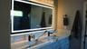 PRIMARY BATHROOM MIRRORSLighted anti-fog mirrors combine style and functionality, providing a modern luxury touch to the primary bath. Wilton Manors 