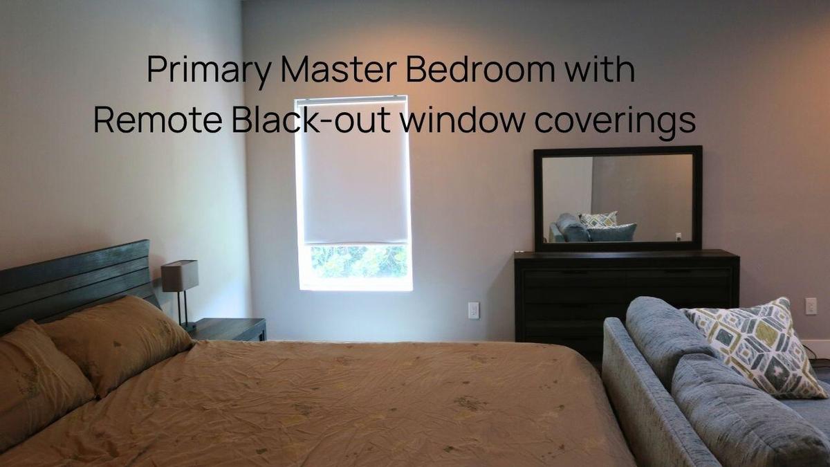 PRIMARY SUITESpacious primary suite offers a peaceful sanctuary with direct access to the outdoor living areas and pool. Wilton Manors home for sale,