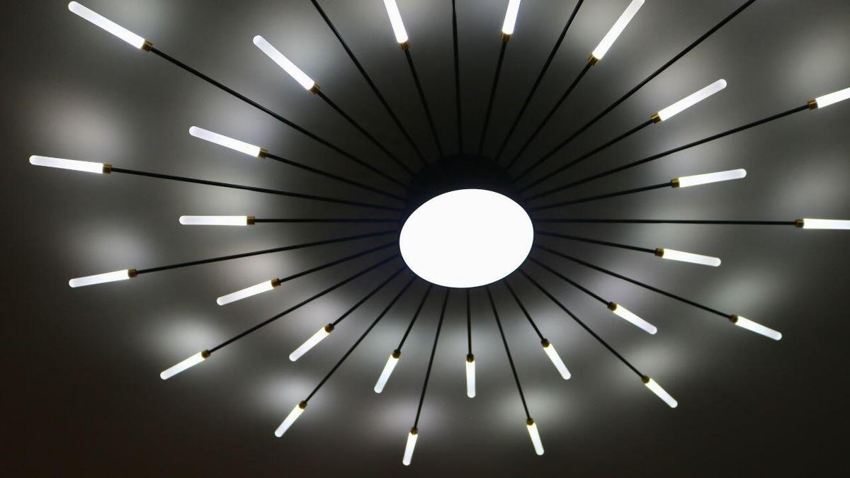 DESIGNER LIGHT FIXTUREDesigner lighting creates a warm ambiance and sophisticated focal point, adding character and elegance to the living space. Wil