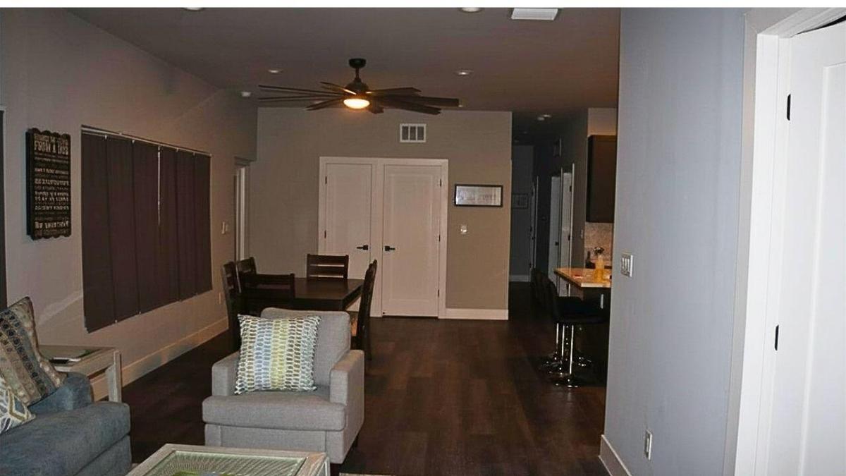 ENTRY TO LIVING ROOM FROM GARAGEConvenient access from the garage opens directly into the spacious living area, offering a seamless transition for da