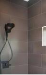 PRIMARY BATHROOM SHOWERSpa-inspired primary bathroom features dual shower heads and an overhead rainfall shower for a luxurious daily experience. Wil