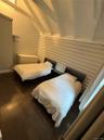 Bedroom featuring dark wood-style flooring