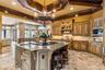 Kitchen with a grand island perfect for hosting & entertaining!