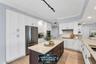 JENN AIR Refrigerator; JENN AIR Dishwasher; Thermador Induction Cooktop; Thermador Wall Oven Microwave Combo; New Cabinetry; Quartzite Countertops wit