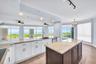 JENN AIR Refrigerator; JENN AIR Dishwasher; Thermador Induction Cooktop; Thermador Wall Oven Microwave Combo; New Cabinetry; Quartzite Countertops wit