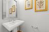 Powder room near the entryway for the main living area.