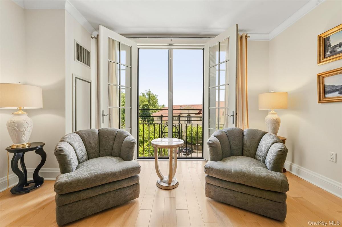 A Juliet balcony with French doors adding so much natural light and magnificent views