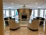 Newly furnished living room lobby with fireplace.