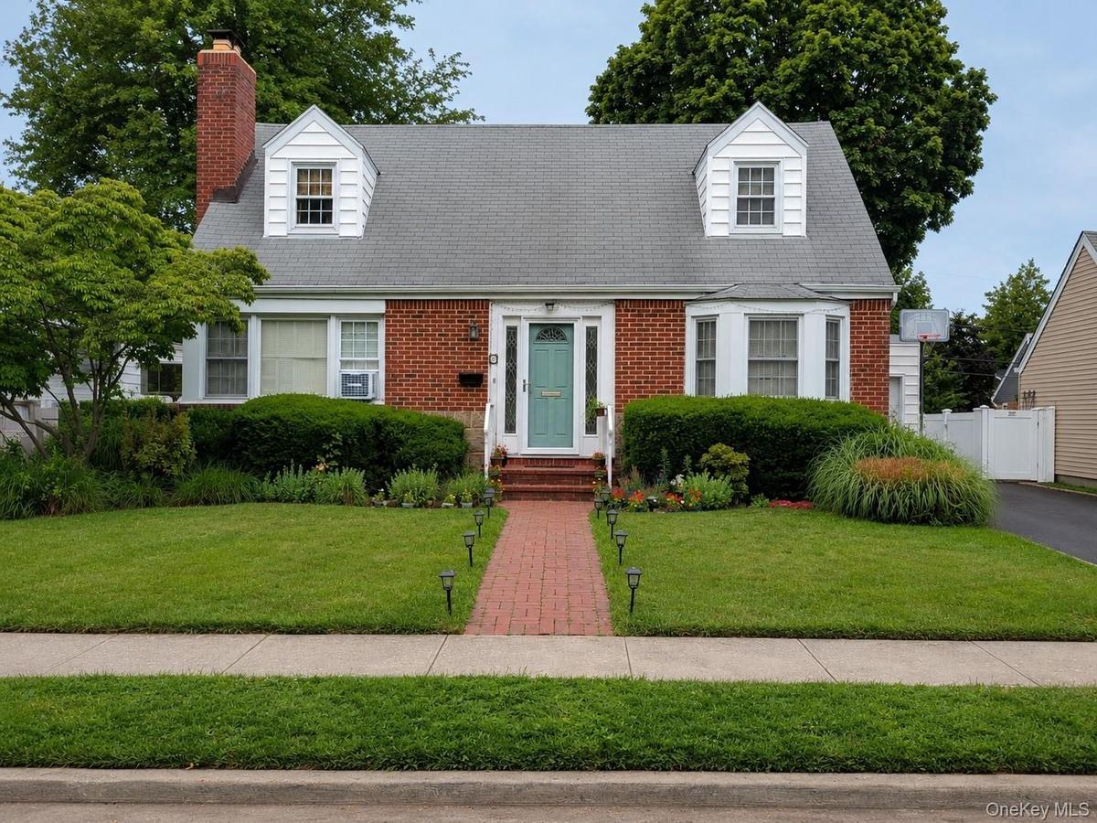 Classic Cape Cod with tidy front yard