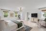 Spacious primary bedroom with bath